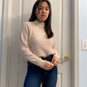 pink turtleneck sweater